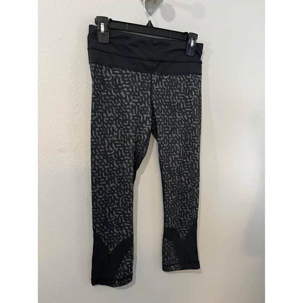 Lululemon Black net Print Run Inspire Crop II Block it Pocket Leggings Size 6